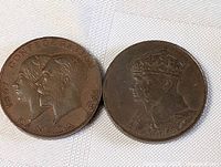 Obverse sides of two Canadian confederation medallions featuring portraits and dates.