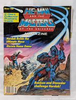 Front cover of the Winter 1986 He-Man and the Masters of the Universe magazine showing illustrated characters and promotion of 2 giant posters inside.