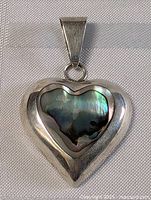 Front view of the pendant showing the full shape and bail attachment.