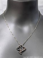 Full view of the necklace on display bust showing the box chain and heart-shaped pendant with 'I LOVE YOU' inscription.