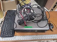 Top view of Dell Optiplex 780 desktop computer with keyboard, mouse, and cables on top