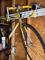 Front-side view showing head tube, handlebars, front wheel and frame paint