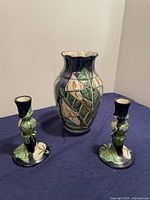 Full view of Talavera ceramic vase and two candle holders with multicolored Calla Lilly floral design.