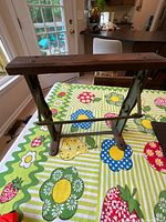 Overall view of wrapping paper holder showing oak top and metal frame