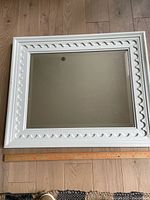 Full view of mirror front with ruler for scale
