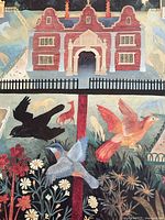 Detail of upper section with red brick birdhouse castle, birds and animals