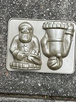 Full view of Nordic Ware Santa cake pan showing both Santa cavities