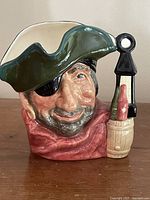 Front view of mug showing smuggler face, hat and eyepatch