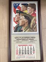 Full view of framed calendar with artwork and calendar pad