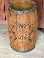 Full exterior view of wooden nail keg with pineapple motif