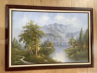 Full view of framed oil painting showing entire mountain landscape and frame