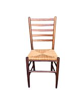 Front view of the dining chair showing woven natural fiber seat and dark wood ladder back.
