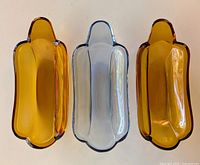 Top view of the three banana split dishes showing two amber and one clear with blue tint glass dishes.