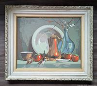 Front view of the vintage paint by number still life painting in decorative cream stacked frame.