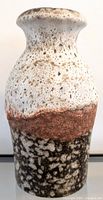 Front view of vintage Scheurich Keramik vase showing textured white and brown Fat Lava glaze in the upper and middle sections with speckled black bottom.