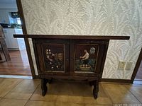 Front view of sideboard cabinet showing overall structure and painted doors.