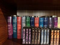 Overview of Reader's Digest condensed books on a shelf in various colors showing titles like 'Dangerous Fortune', 'The Cam Who Went into the Closet', 'The Select Editions'