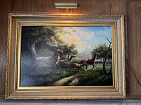 Full view of framed painting showing deer scene