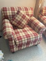 Front left angled view showing rolled arm and throw pillow