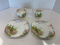 Set of Royal Albert Kentish Rockery cream, sugar, and 2 plates arranged to show pattern and shape.