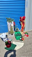 Full lot including boxed Christmas tree, assorted lights, decorations, Christmas goose figure, ribbons, ornaments and storage bins.