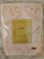 New in packaging Highgate Manor velvet fleece throw folded inside clear plastic wrap. Label on front with brand and product name.