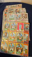 Photo of a varied collection of vintage Miami Dolphins football cards showcasing individual player portraits and action shots.