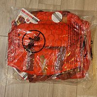 Photo of the packed Microban Go Anywhere Insulated Tote Set with visible orange and brown coloration and clear packaging