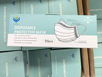 Close-up image of a box showing product information for disposable protective mask with 50 pieces.