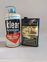 Front view of 2 vintage metal cans: Klear Floor Wax and Van Sciver Wood Cleaner & Polish.