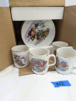 Mugs and plates with Campbell Soup Kids illustrations inside original box, showing set condition and packaging