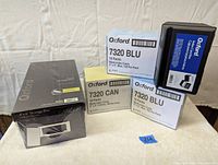 Photo shows 3 boxes of Oxford index cards (blue and canary), a black plastic Oxford card box, and a black Roxo cardboard 4 x 6 storage box.