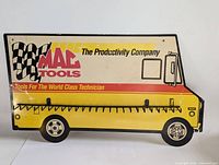 Front view of the vintage Mac Tools tool truck key holder rack showing logo and multiple hooks for keys.