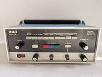 Front view showing control panel with knobs, buttons, and labeled test pattern settings.