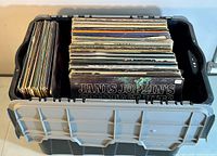 Overhead view of plastic crate filled with 12" vinyl LP albums