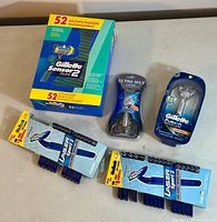 Photo showing the whole lot with Gillette Sensor 2 Plus 52 disposable razors box, two Gillette Laser Sport 2 smaller disposable packs, plus one Ultra Max razor and one Gillette Fusion ProGlide Power razor in packaging.