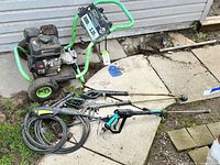 Full view of pressure washer with hose and wand