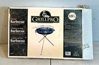 Front of the box displaying Grill-Pro branding, BBQ image, size, and features
