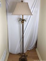 Full view of lamp showing entire height, shade, midsection, base