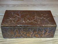 Top view of the rectangular copper embossed wooden box showing detailed floral and leaf embossing.