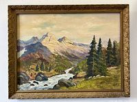 Full view of the antique framed mountain landscape oil painting showing the entire artwork and frame.
