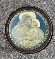 Front view of the framed circular art print showing the Madonna and Child illustration with detailed colors and frame condition.