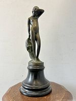 Front view of bronze statue on base