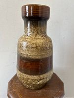 Front view of West German mid-century pottery vase with textured fat lava glaze.