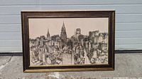 Framed black and white lithograph print of NYC skyline showing skyscrapers from a bird's eye view, rectangular brown and gold frame.