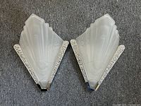 Front overview of both sconces lying on carpet