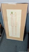 Frontal view of the framed art print showing the two stylized nude figures and the overall condition of the frame and matting.