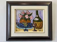 Framed vibrant oil painting on board of wine grapes, flowers, wine glass and bottle, signed by W Powell.
