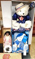 Full lot showing two boxed bears and Schmidt doll in box
