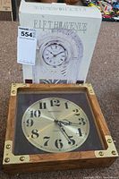 Front view showing both clocks, Mercedes wall clock and boxed Fifth Avenue clock